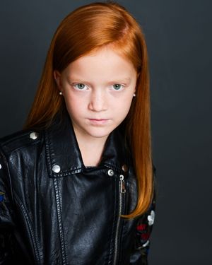 A series of portraits featuring red hair and a black leather jacket against a dark background.