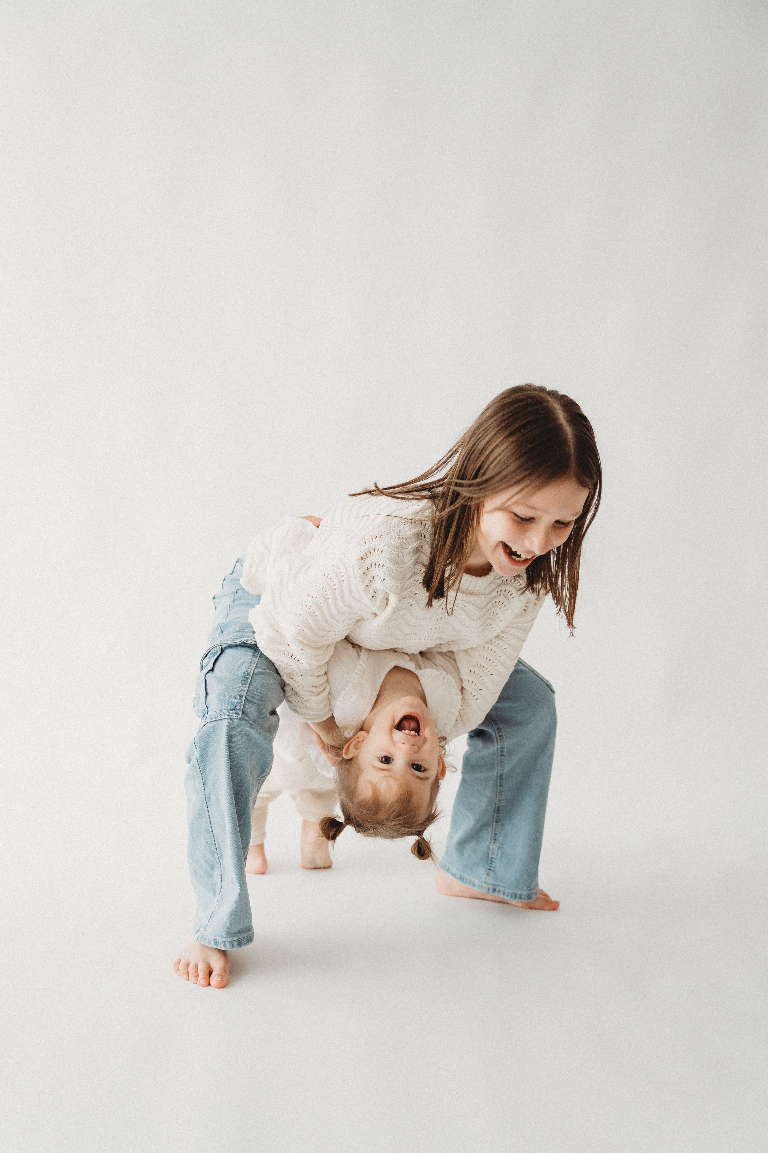 family having loving moments together during photoshoot in Mudgeeraba studio