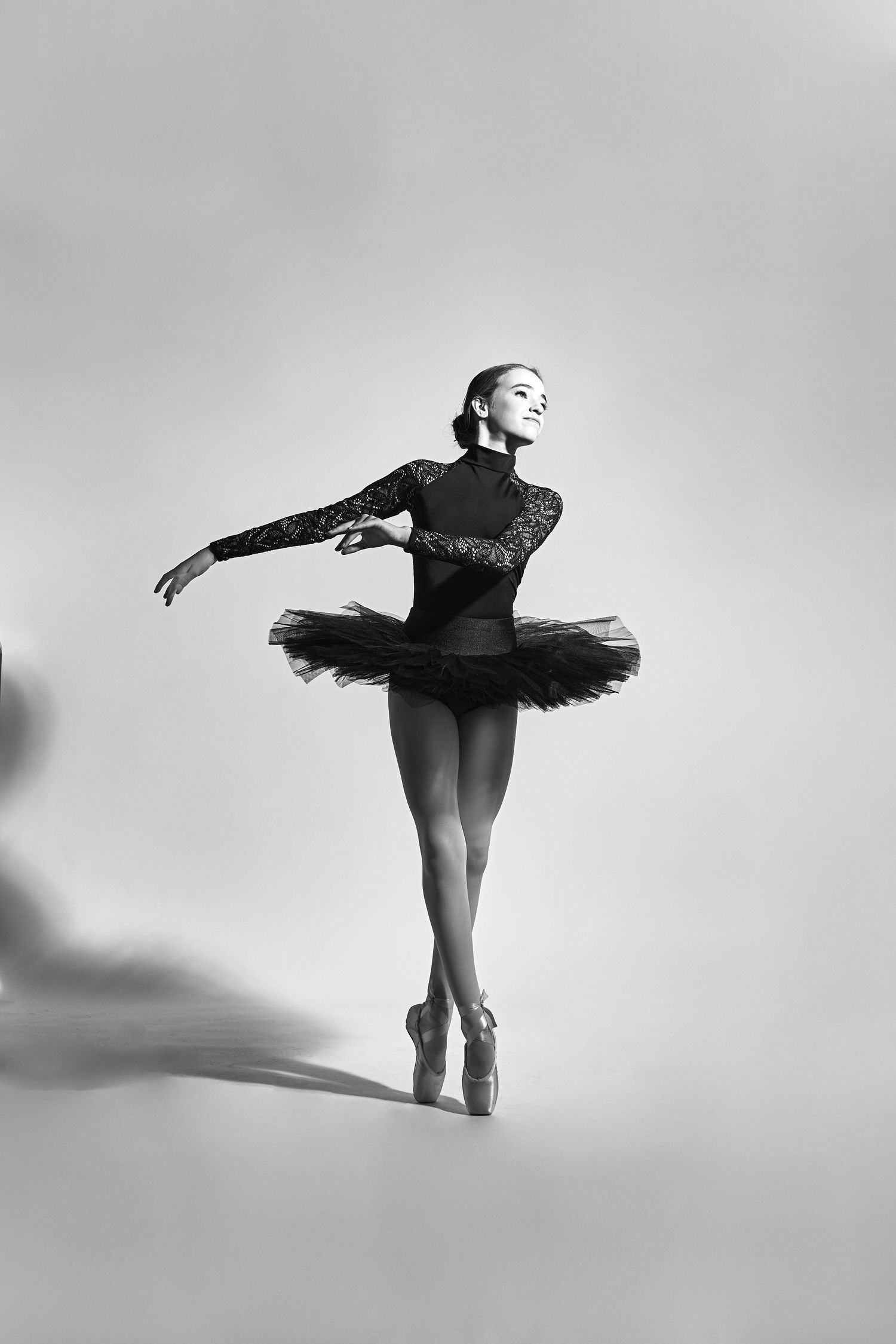 Black and white ballet series showing graceful dance movements and tutu silhouettes.