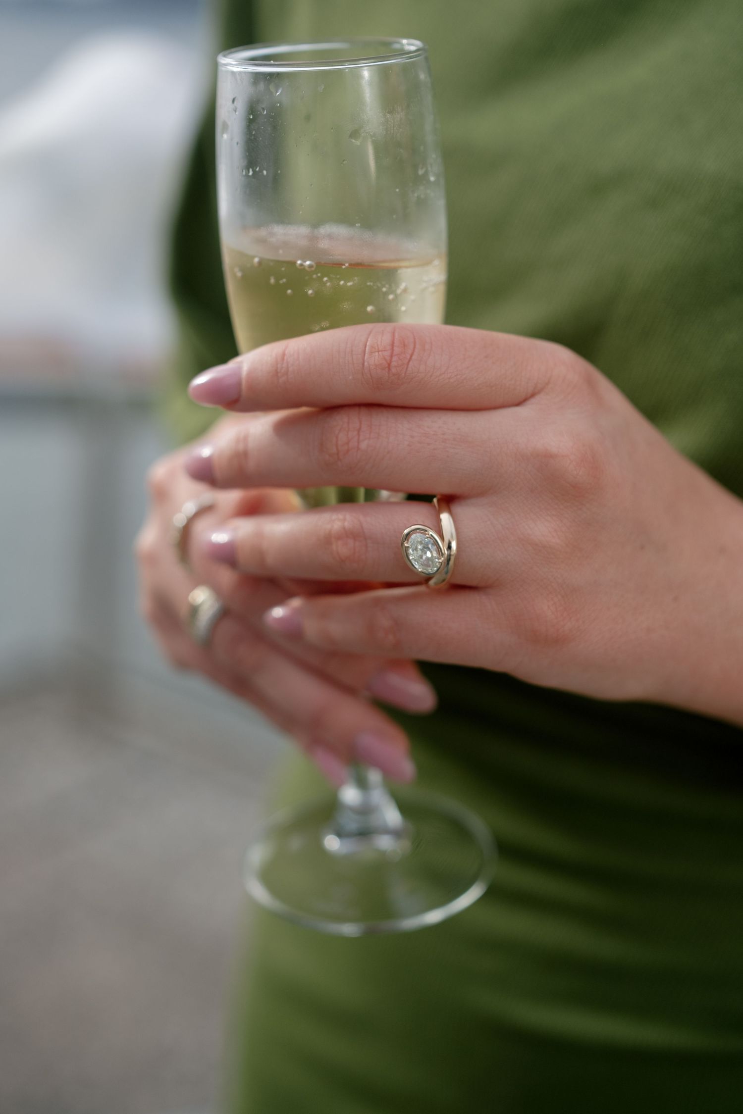 Wedding reception guests raising glasses in a toast during celebration.