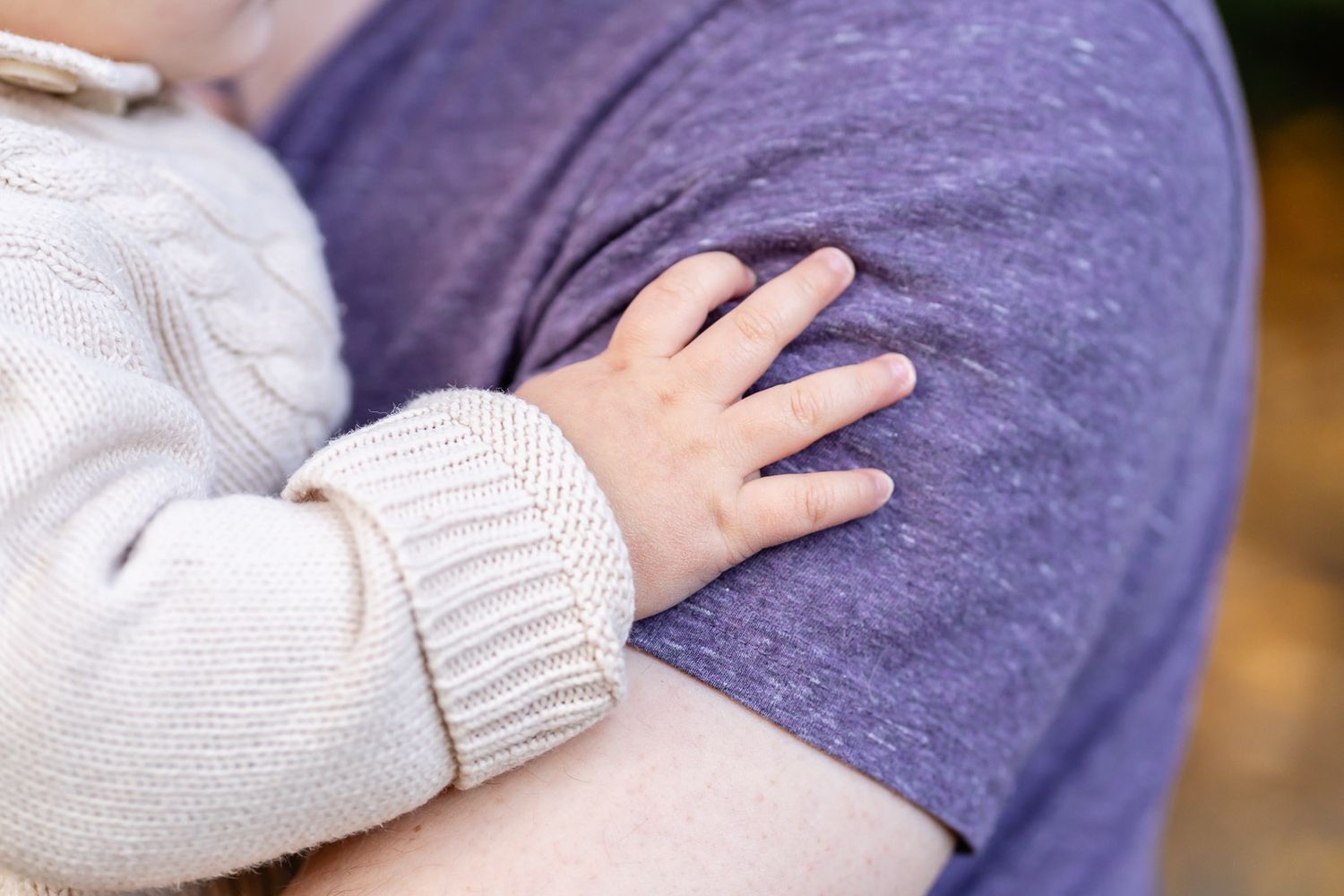 Detail photo of a baby's hand.