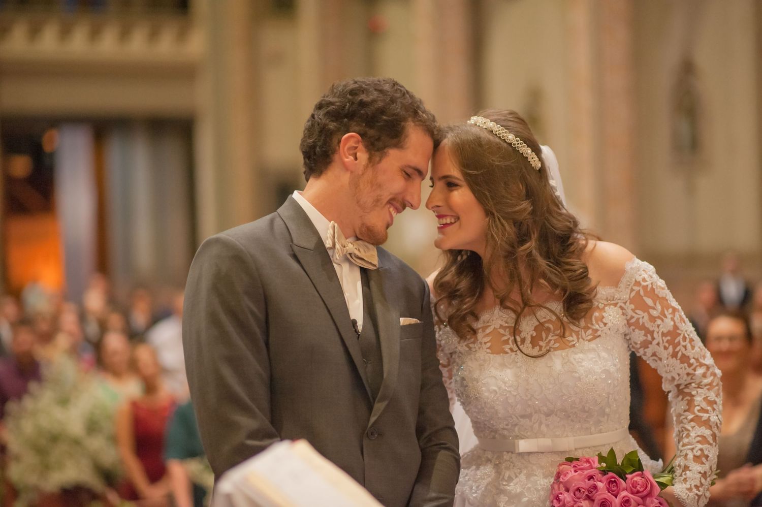 Intimate moment between newlyweds during their church wedding ceremony.