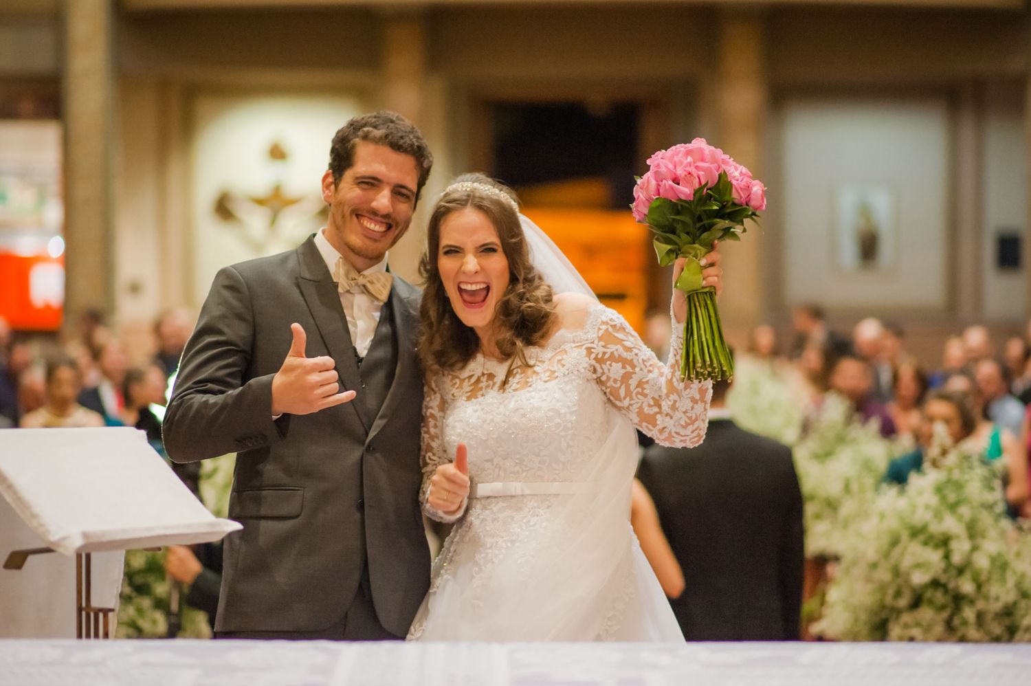 Joyful newlyweds celebrate after their church wedding ceremony.