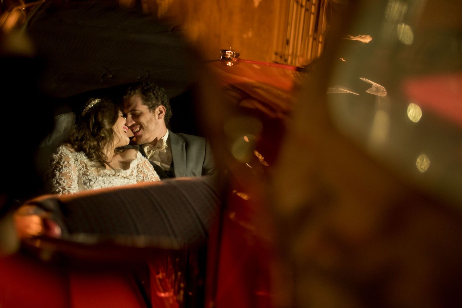 Romantic nighttime portrait through bokeh lights and shadows.