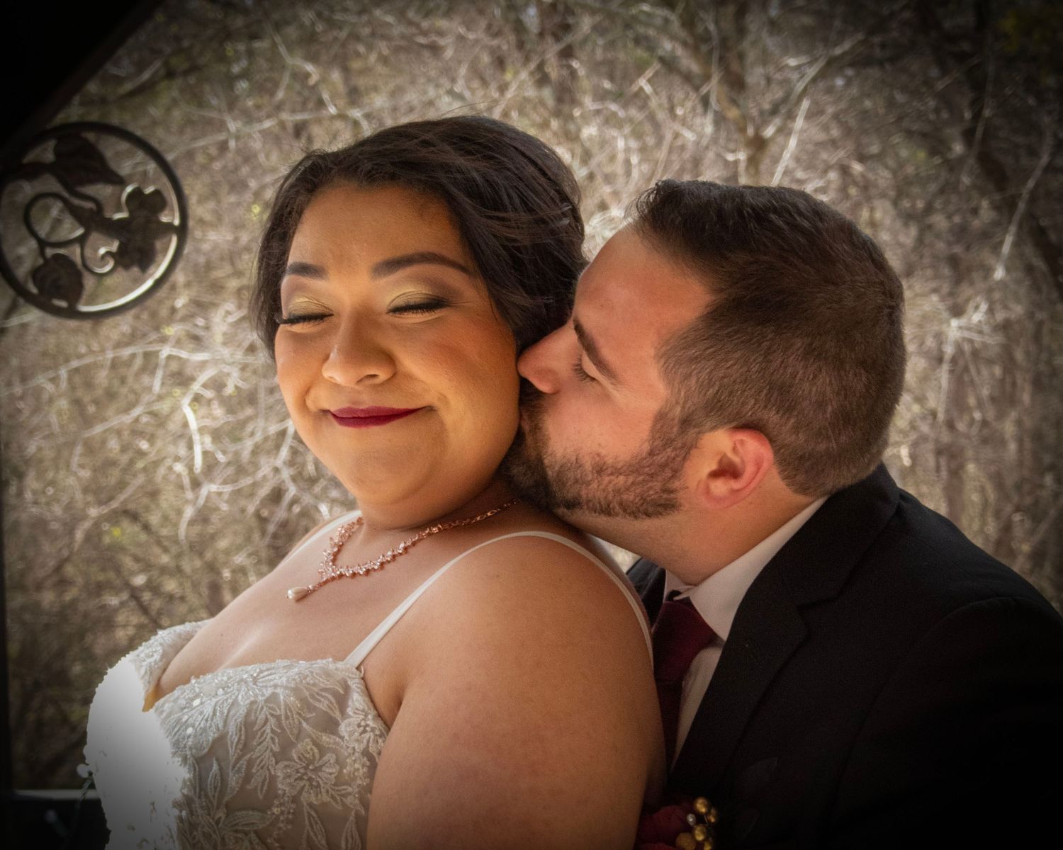 A tender moment between newlyweds as they embrace during their wedding celebration.