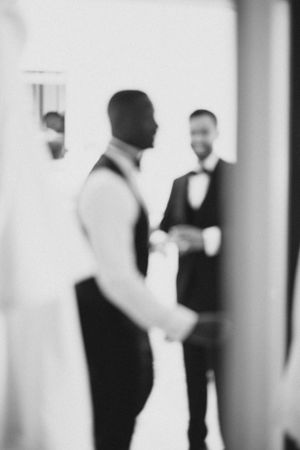 Artistic black and white blurred photo of wedding preparations.
