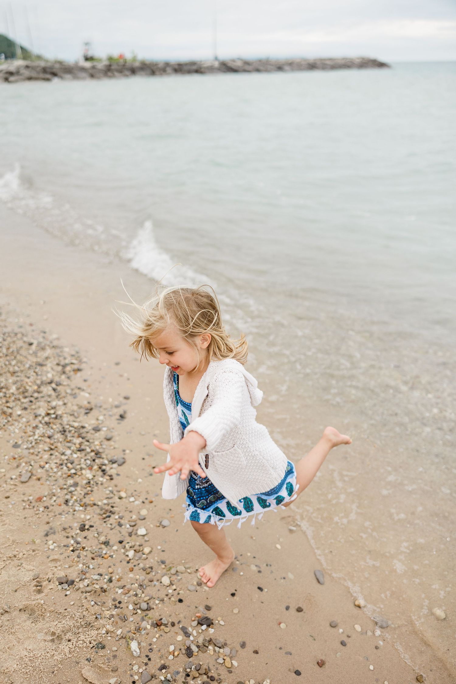 Child playing on in Leland, Michigan Captured By Grace Hudson Photography Traverse City