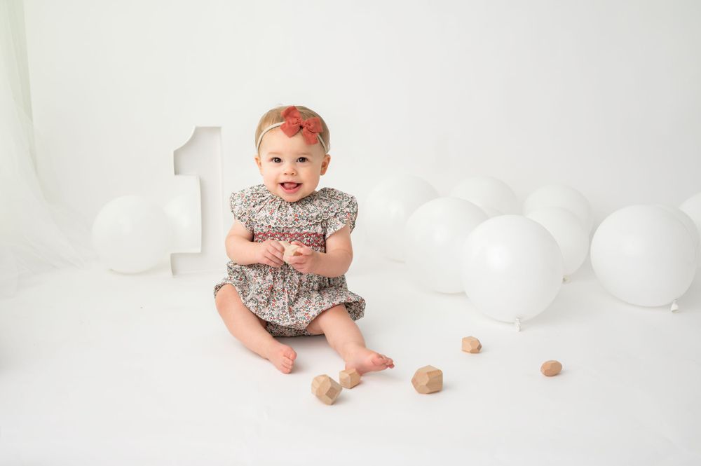 Milestone portrait of a joyful girl dressed in a cute outfit and smiling – Precious Twenty-One Photography