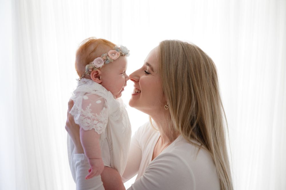 Milestone portrait of a joyful girl dressed in a cute outfit and smiling with mom – Precious Twenty-One Photography