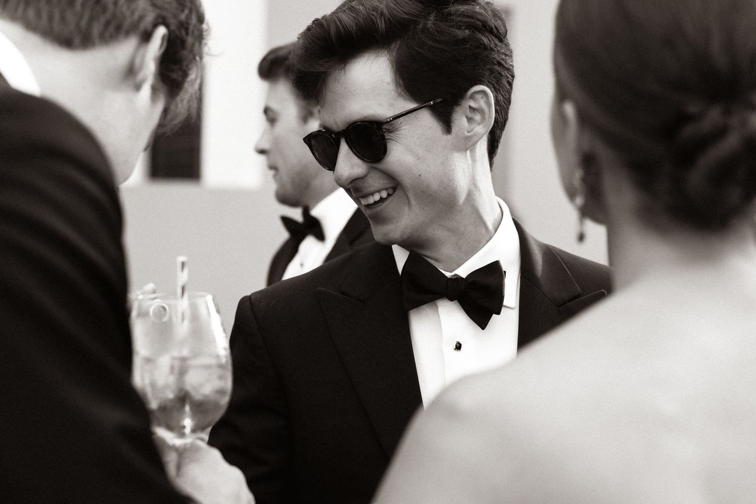 Elegant black and white wedding celebration moment captured in candid style.