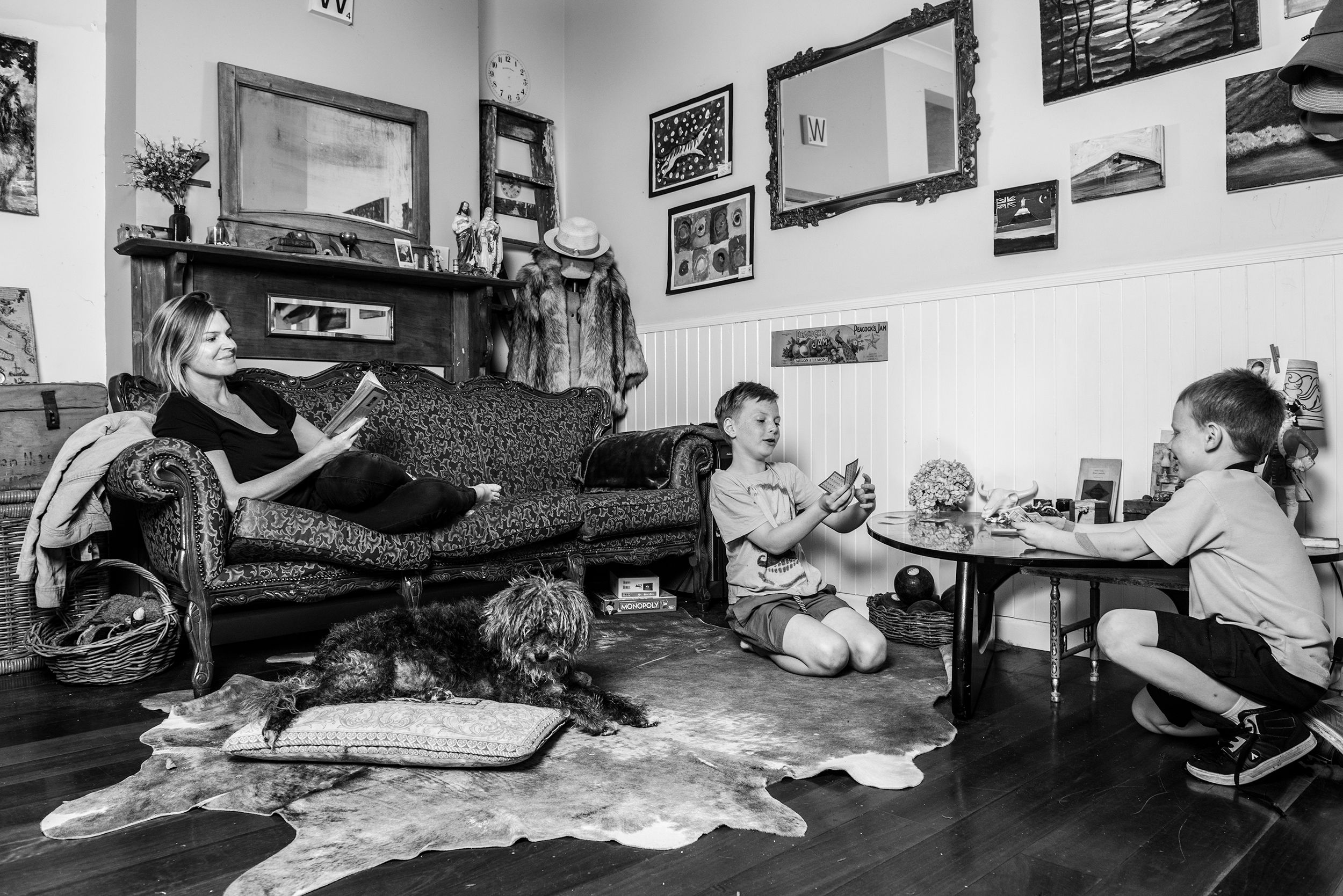 Group lounging together on a couch during a casual indoor gathering.