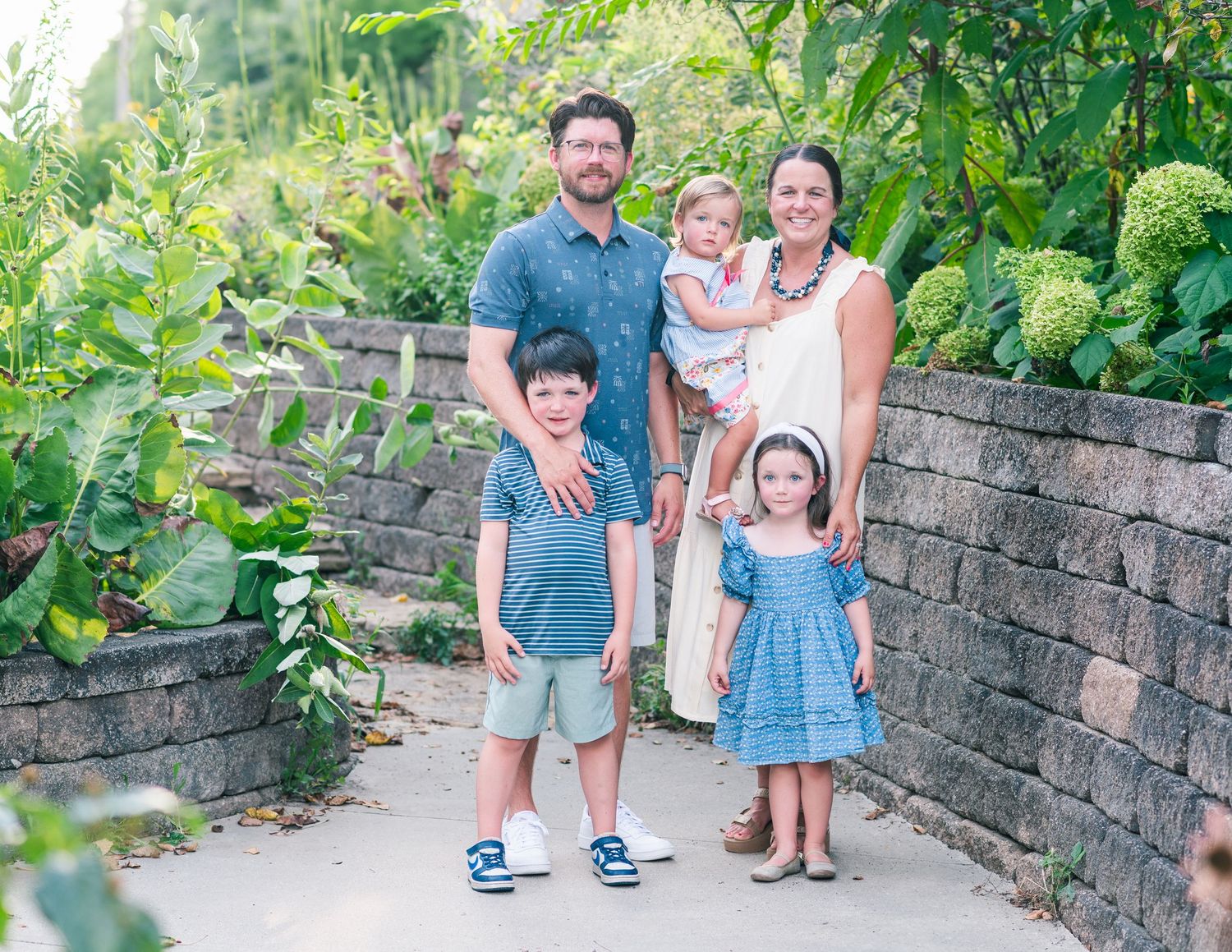 Shelbyville, Illinois family posed during a family session in the Botanical Garden by Julie Loy Photography