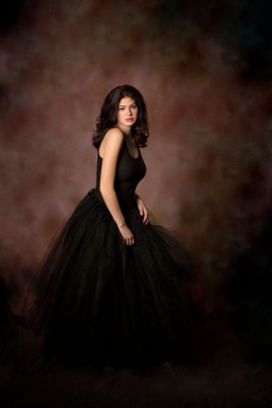 Girl in formal dress in studio