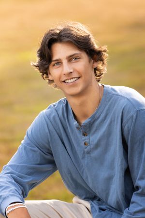 High school senior boy with backlit sun portrait