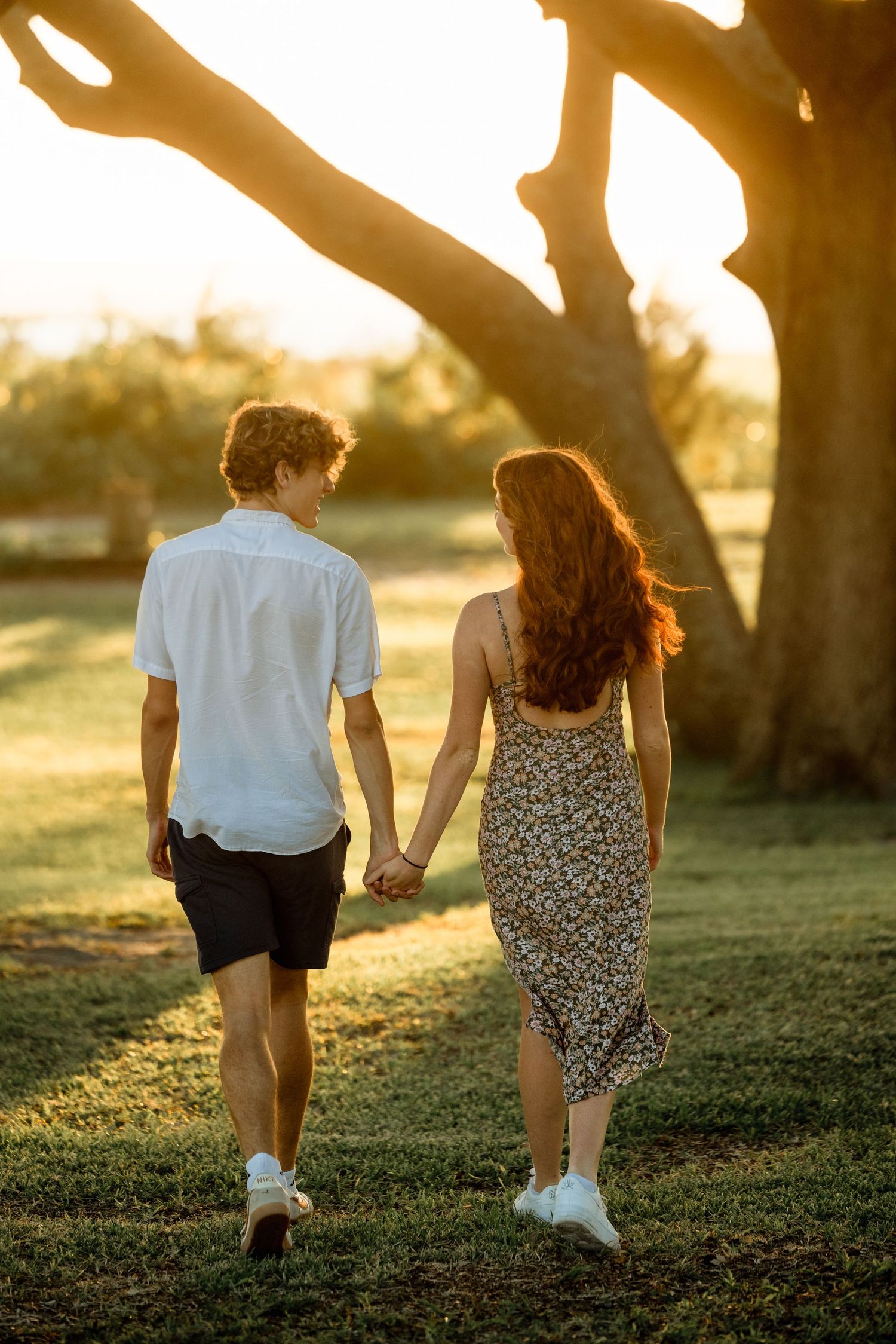 A couple enjoying each other on a walk at sunset near Carolina Beach