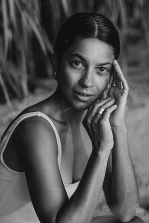 Artistic black and white close-up portraits showing emotional expressions and gestures.