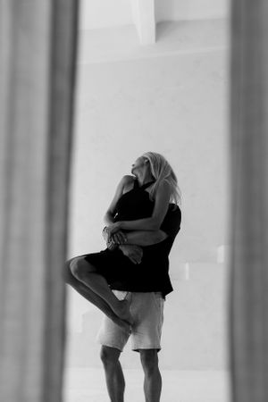 Artistic black and white silhouette series capturing intimate poses.