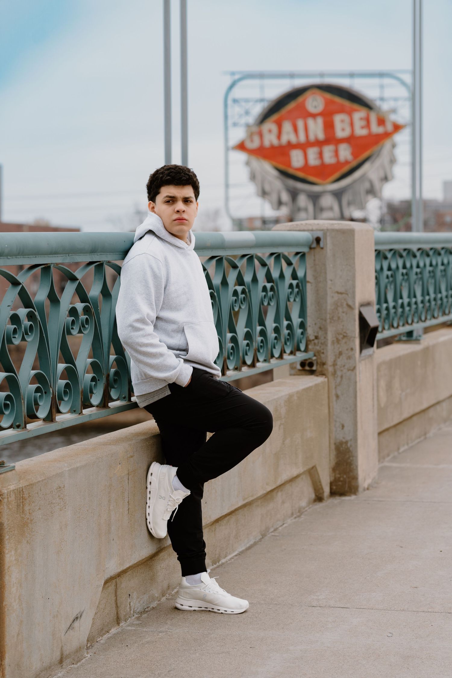 Juve Photography Senior guy Portraits by the sign of Grain Bell Beer in Downtown  Minneapolis Minnesota