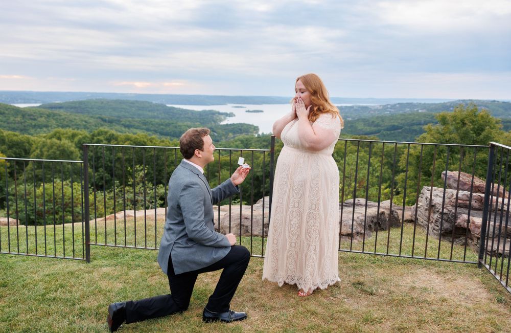 A couple getting engaged at top of the rock in Branson Missouri near big cedar lodge.