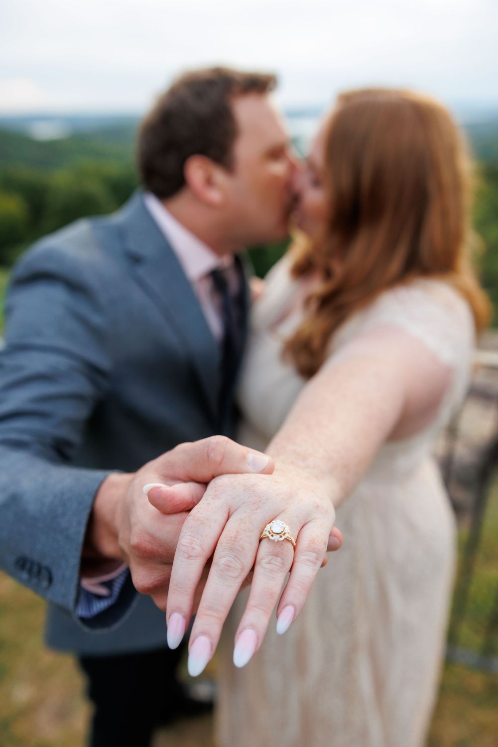 A couple getting engaged at top of the rock in Branson Missouri near big cedar lodge.