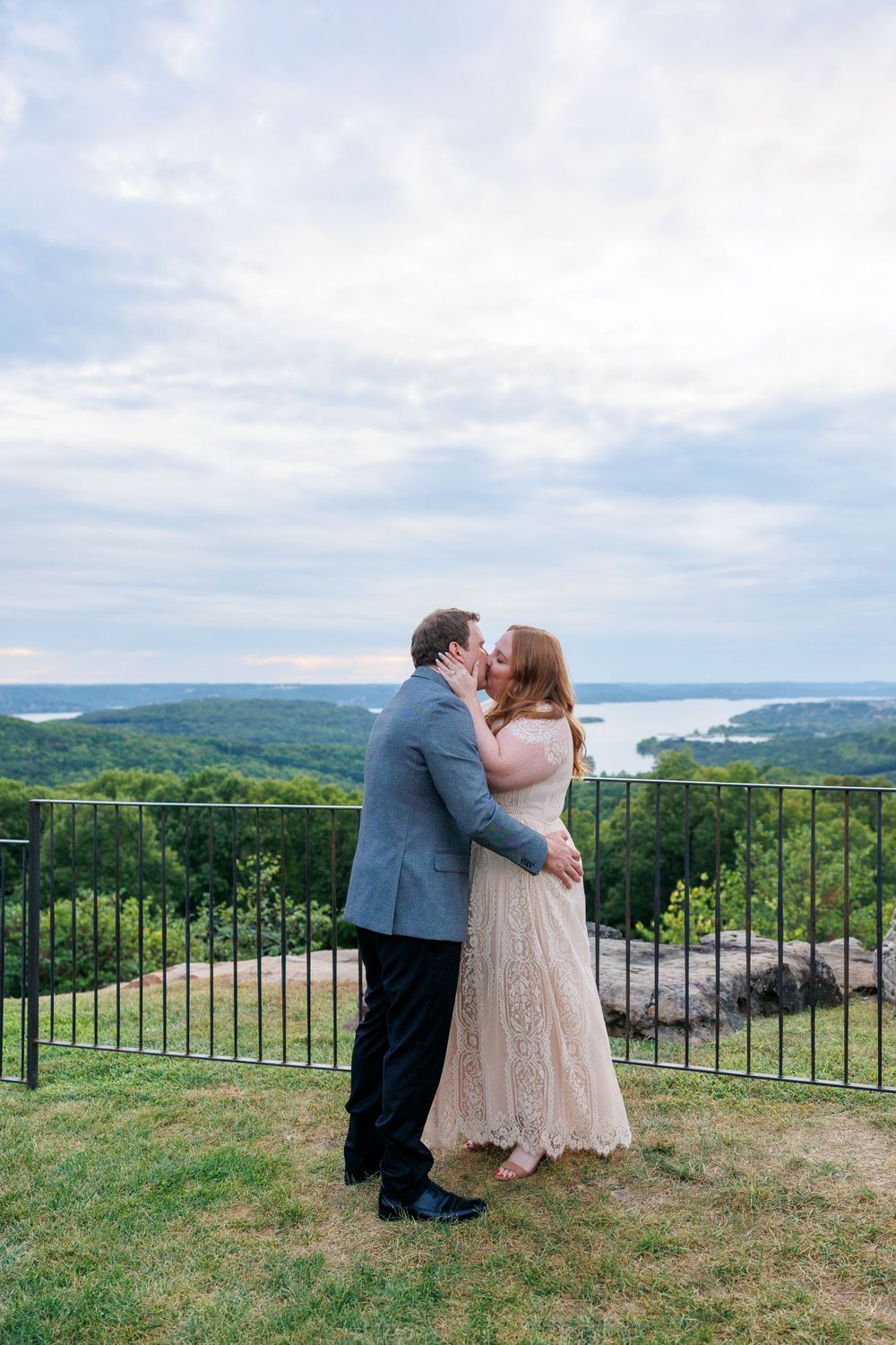 A couple getting engaged at top of the rock in Branson Missouri near big cedar lodge.