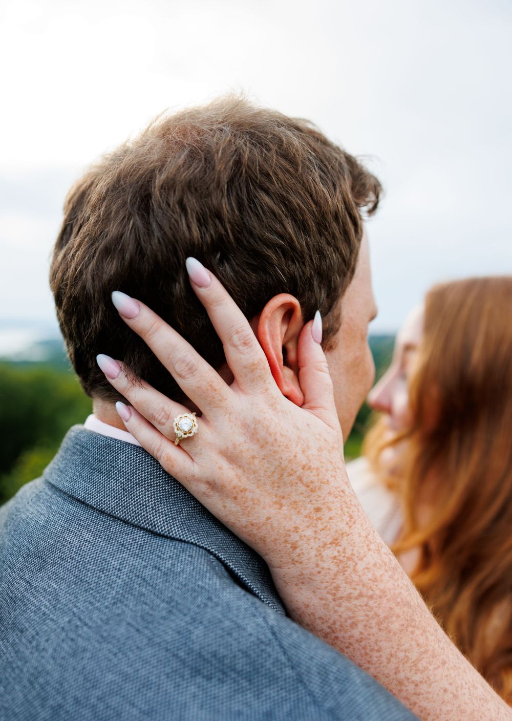 A couple getting engaged at top of the rock in Branson Missouri near big cedar lodge.