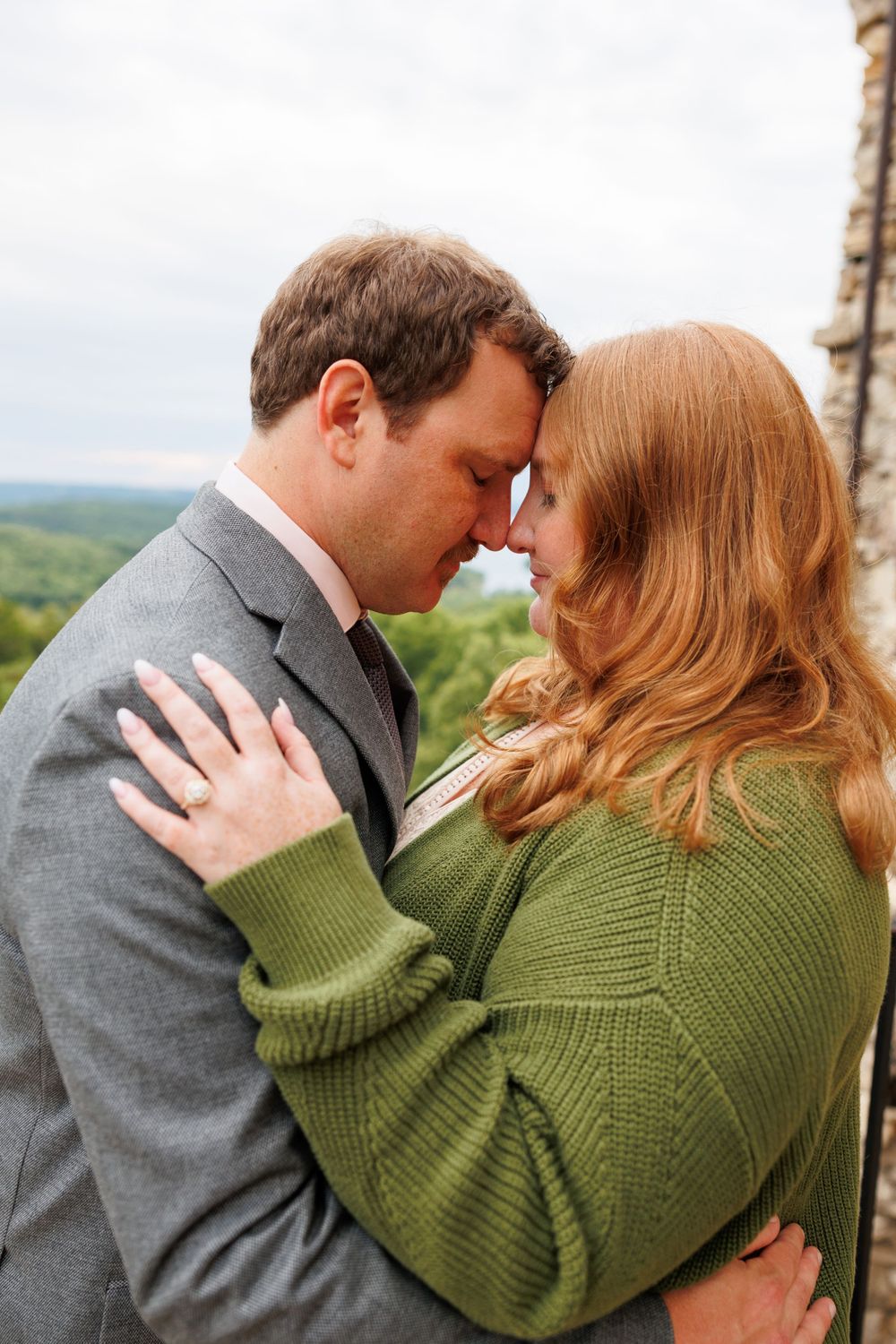 A couple getting engaged at top of the rock in Branson Missouri near big cedar lodge.