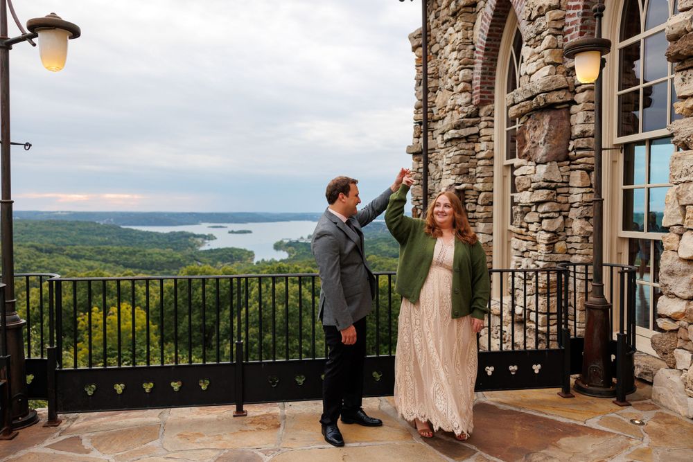 A couple getting engaged at top of the rock in Branson Missouri near big cedar lodge.