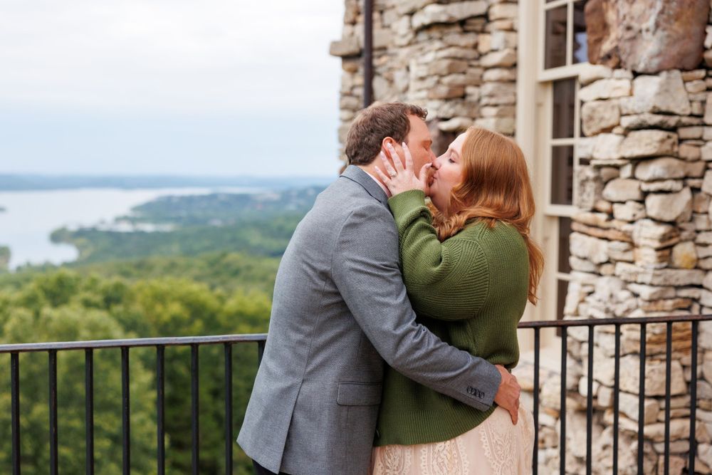 A couple getting engaged at top of the rock in Branson Missouri near big cedar lodge.