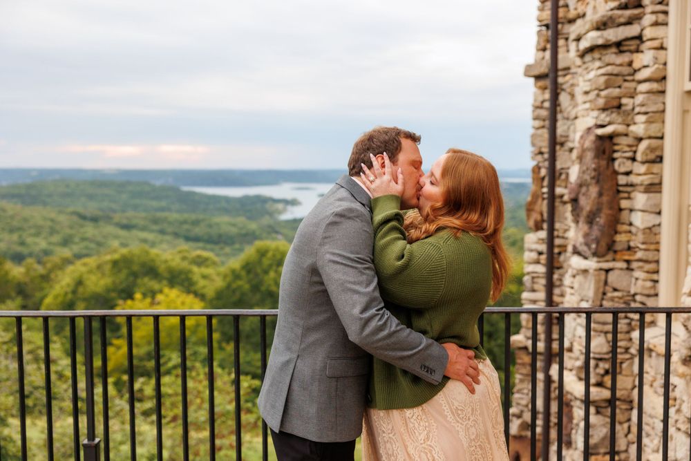 A couple getting engaged at top of the rock in Branson Missouri near big cedar lodge.