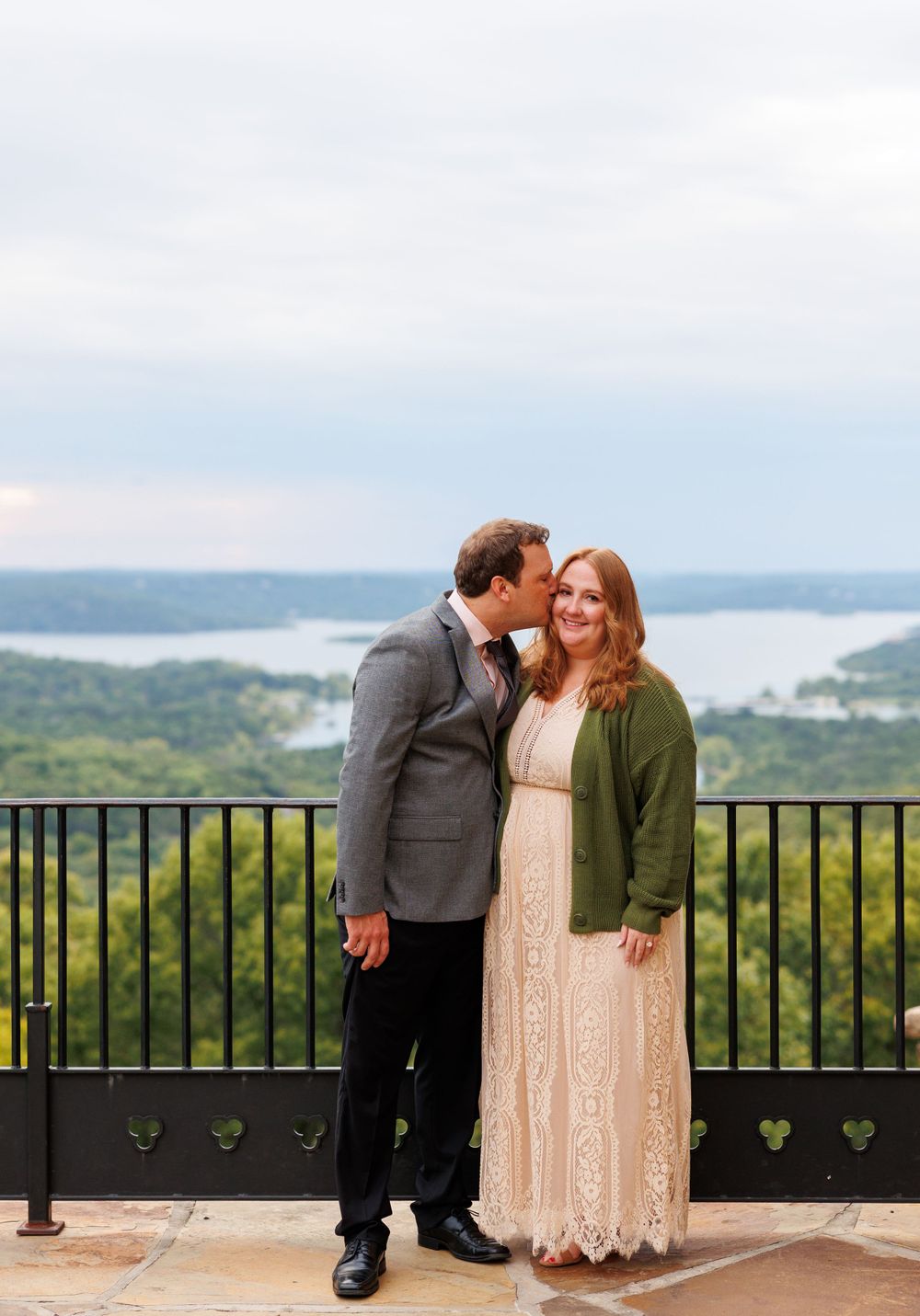 A couple getting engaged at top of the rock in Branson Missouri near big cedar lodge.