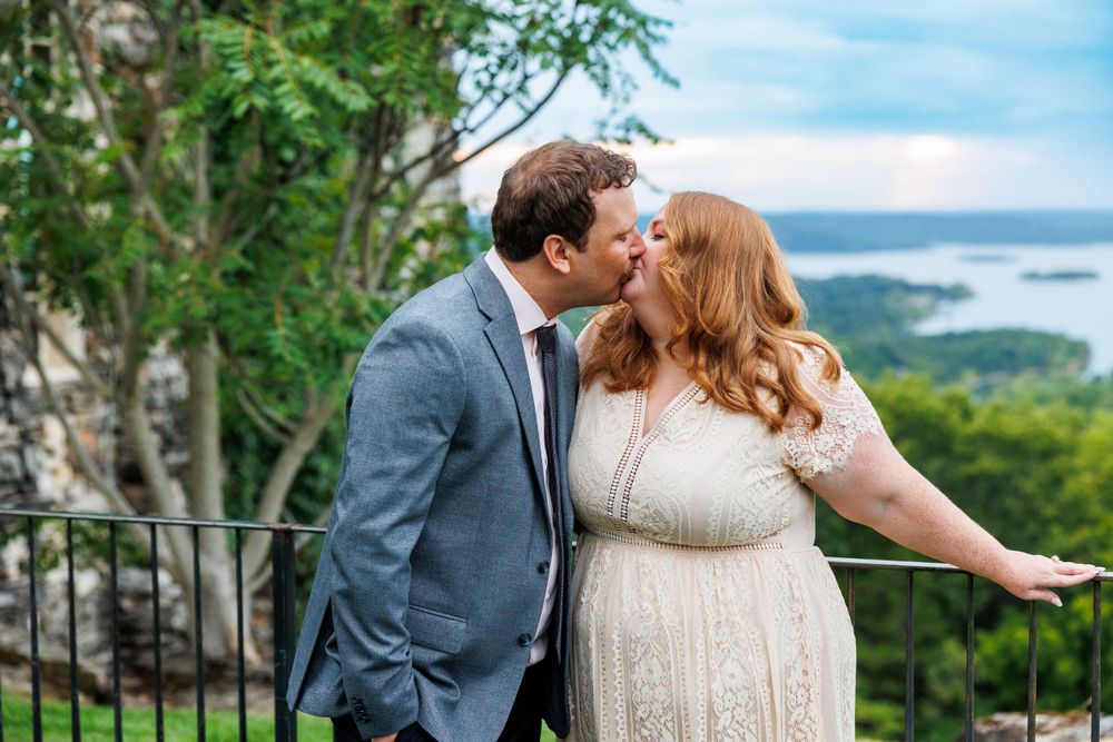 A couple getting engaged at top of the rock in Branson Missouri near big cedar lodge.