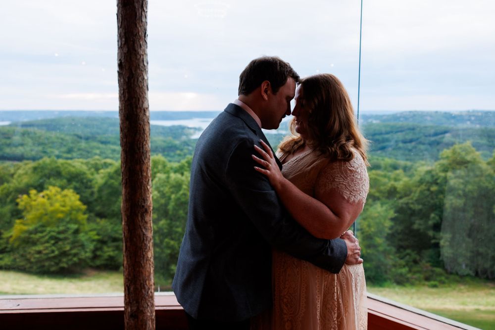 A couple getting engaged at top of the rock in Branson Missouri near big cedar lodge.