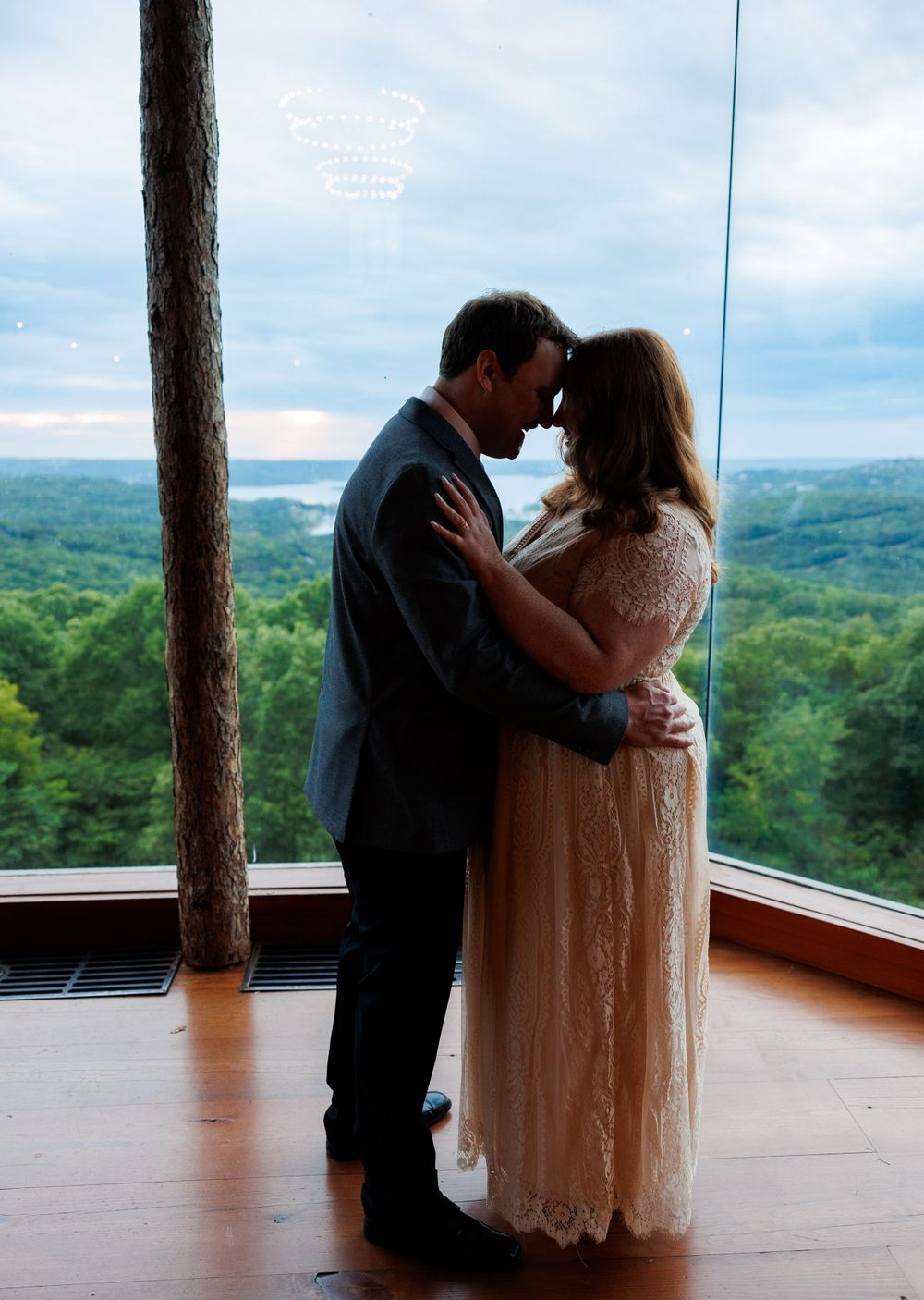 A couple getting engaged at top of the rock in Branson Missouri near big cedar lodge.
