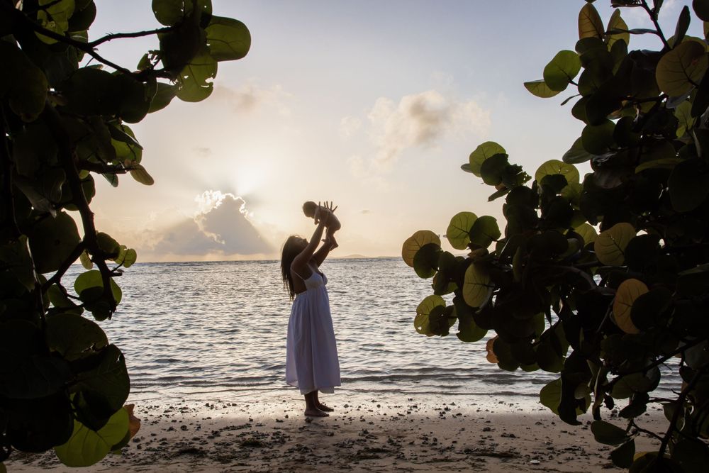 Destination maternity shoot. Mother and child photo shoot.  Photo was captured in Puerto Rico.  Mother and child infront of the beach.