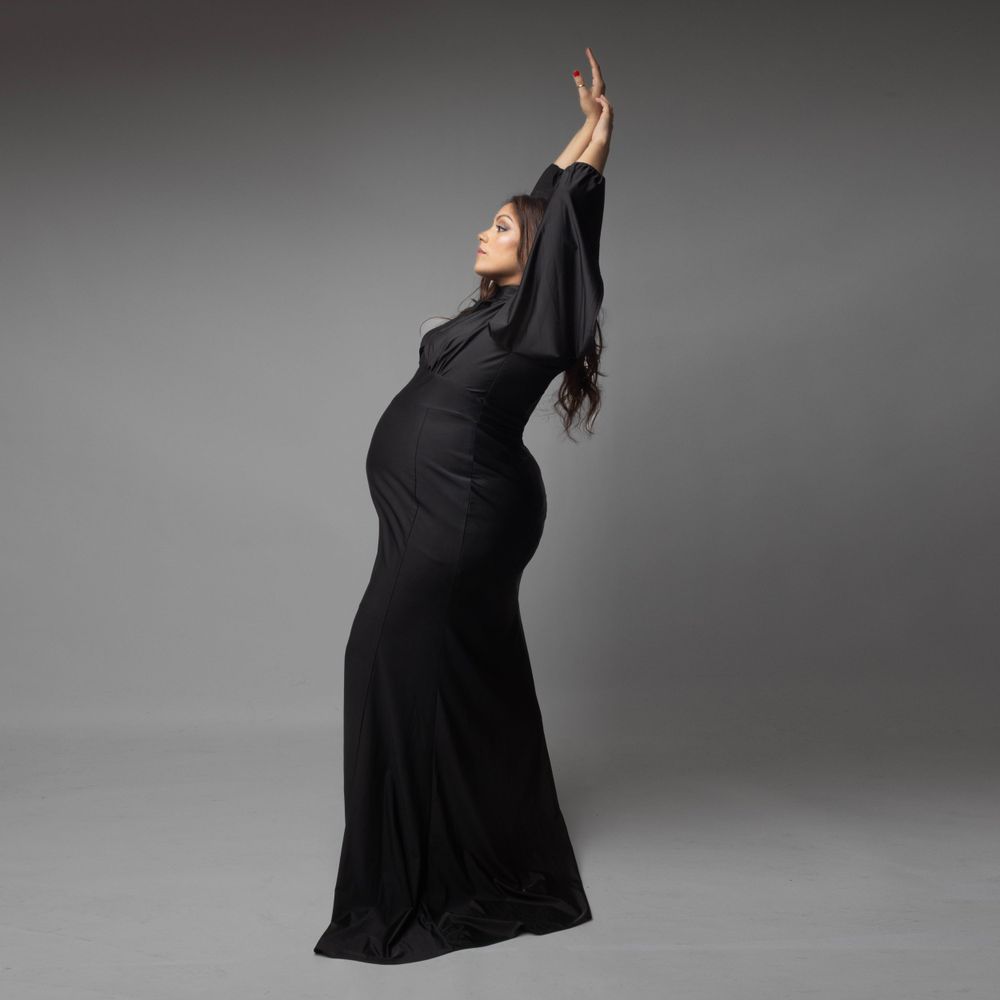 Pregnant model posing in a minimalist set.  Shot in Long Island photo studio