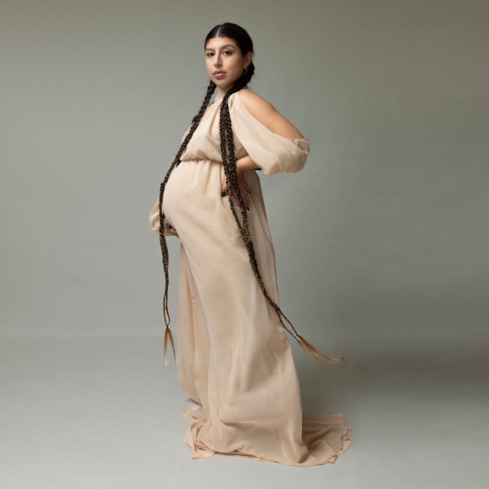Mexican pregnant model from NYC photographed in a minimalistic studio set.  Photographed in a long island photo studio.