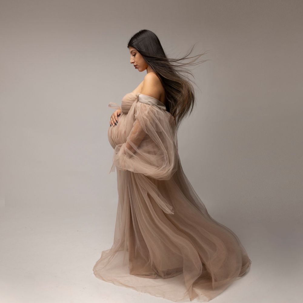 Pregnant model from NYC photographed in a minimalistic studio set.  Photographed in a long island photo studio.