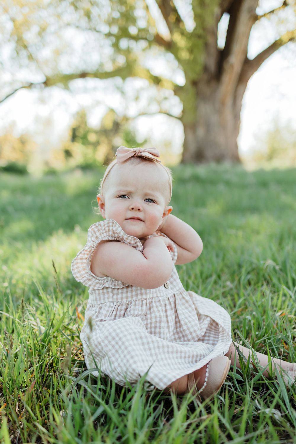 Baby Girl Sitting in Green Field