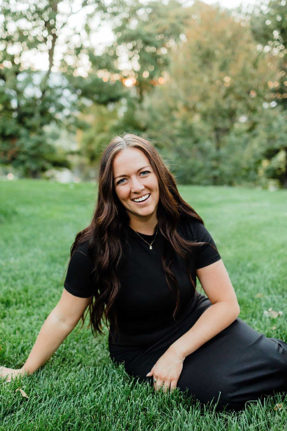 Portrait of Woman Wearing Black in Green Field
