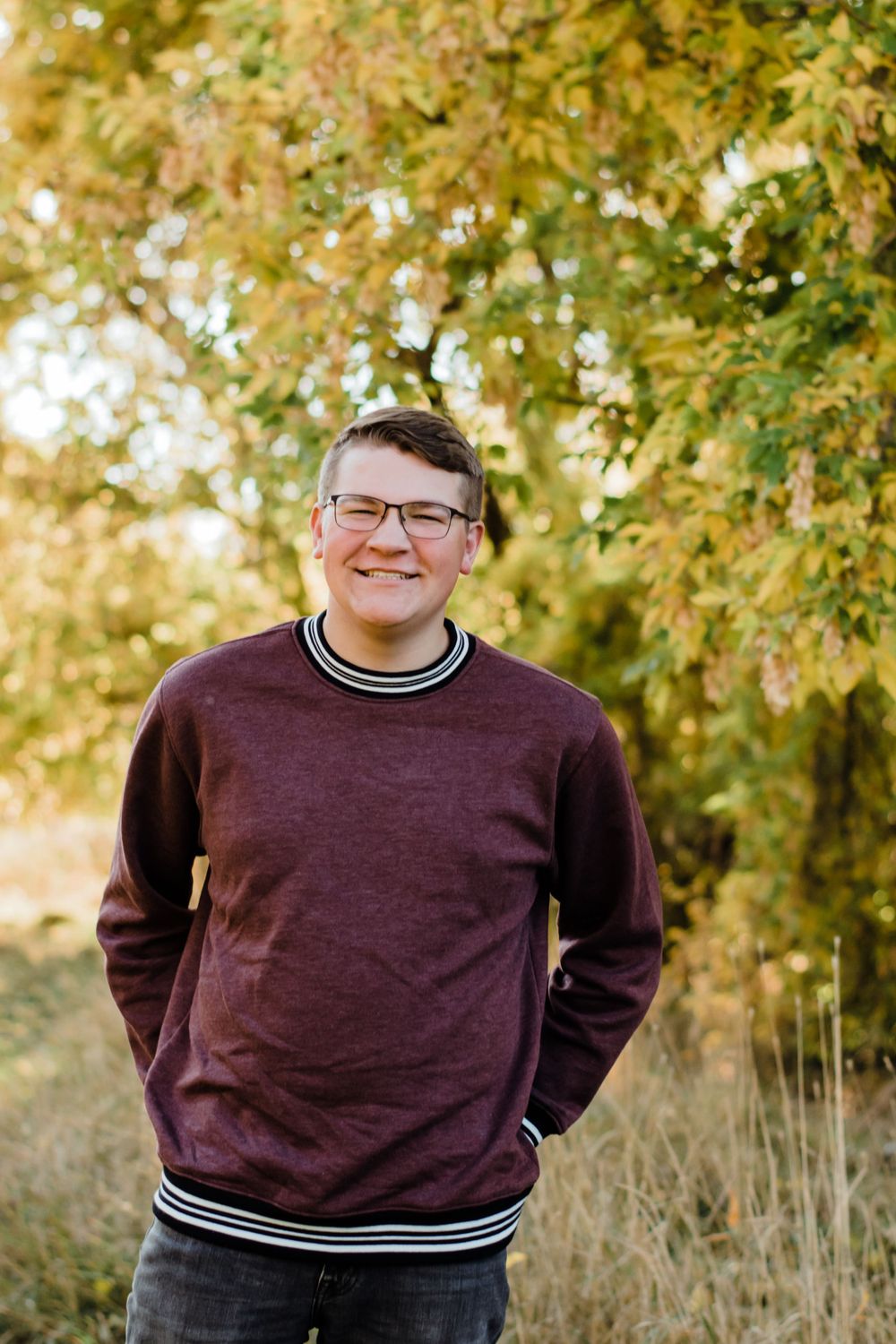 Young Man's Senior Year Autumn Leaves