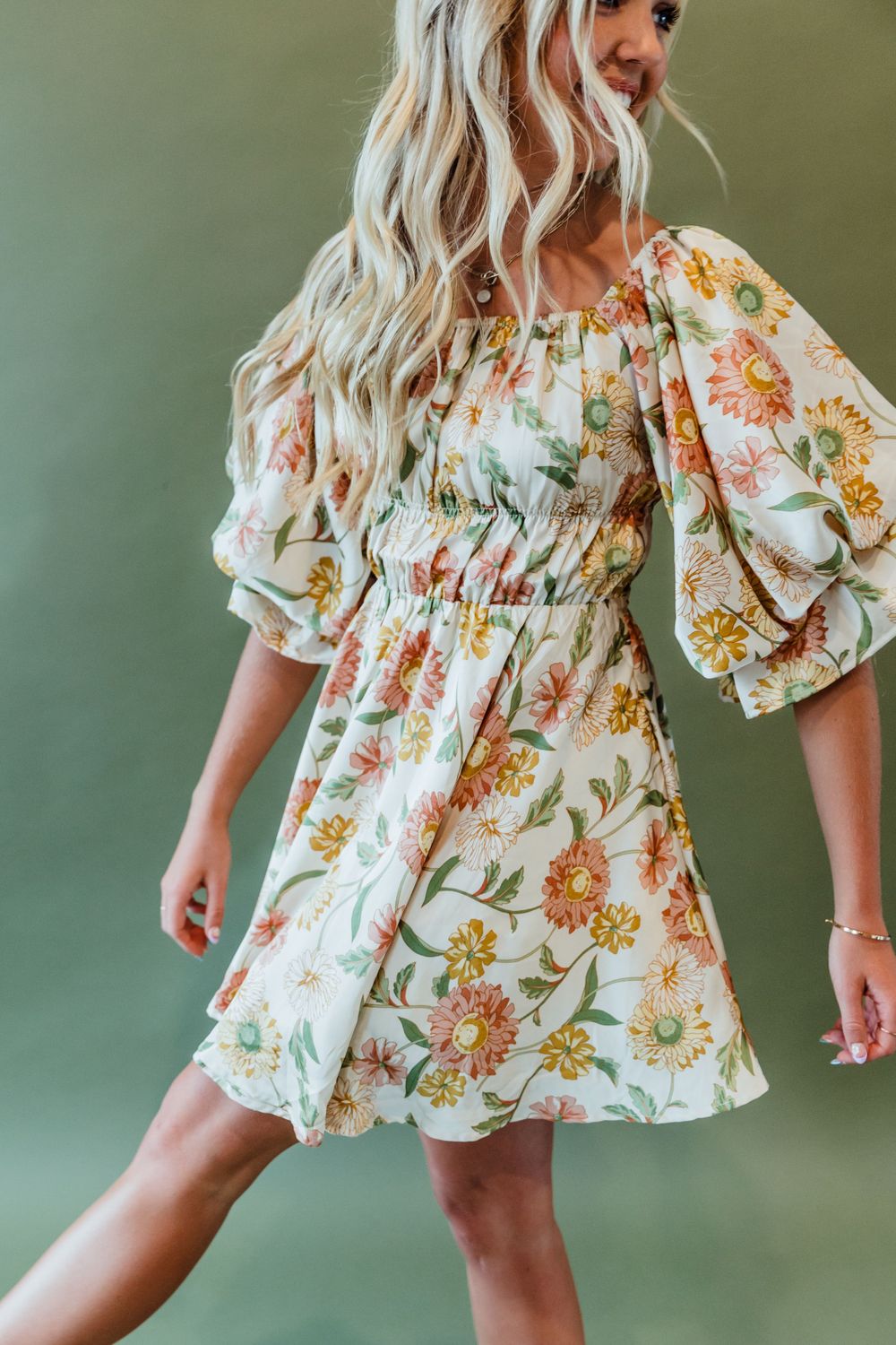 Studio Portrait of Blonde Girl in Dress Green Backdrop