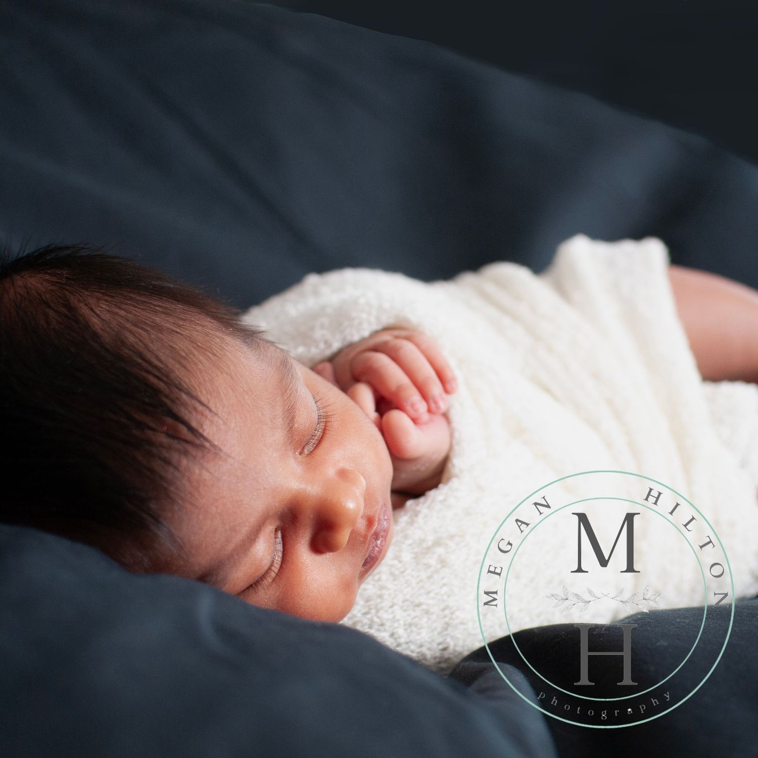 Baby boy sleeping black background photo