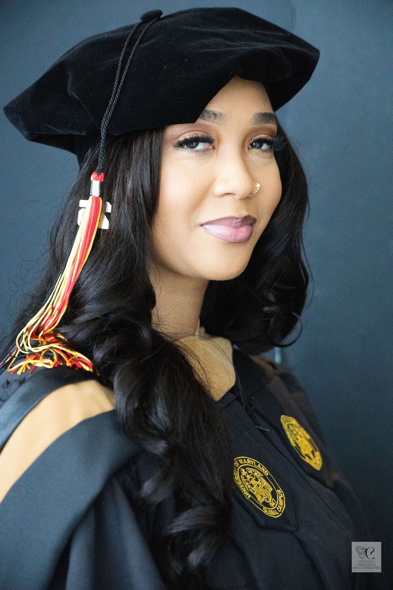 Graduate wearing black cap and gown with yellow emblem and tassel smiles in a series of celebratory graduation photos.