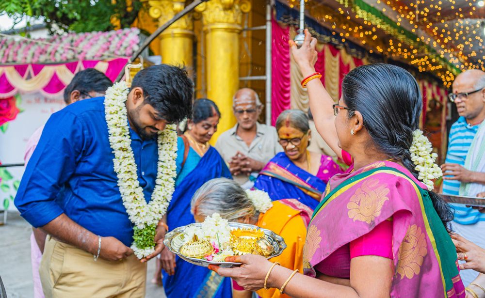 Traditional Indian ceremony with guests participating in ritual offerings.