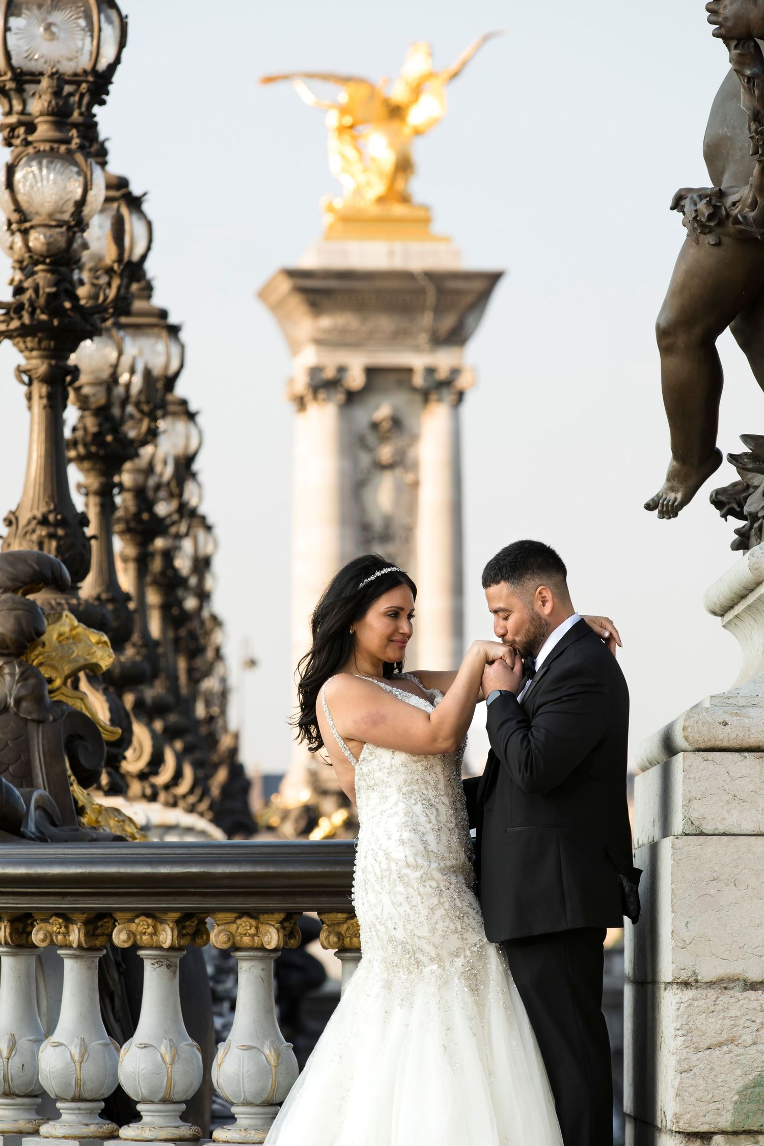 A romantic stroll for a newly married couple hand-in-hand on the Alexander III Bridge. Captured by Julien LB Photography