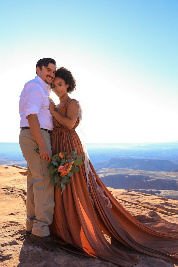 bride wearing orange dress in a desert