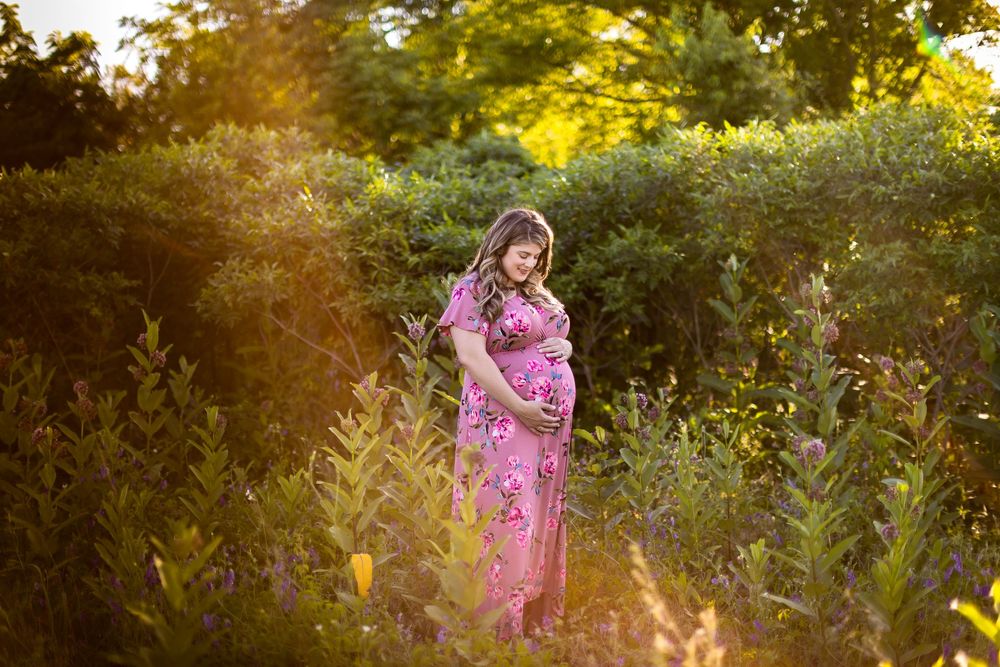 Golden hour photography session in a field of wildflowers during sunset.
