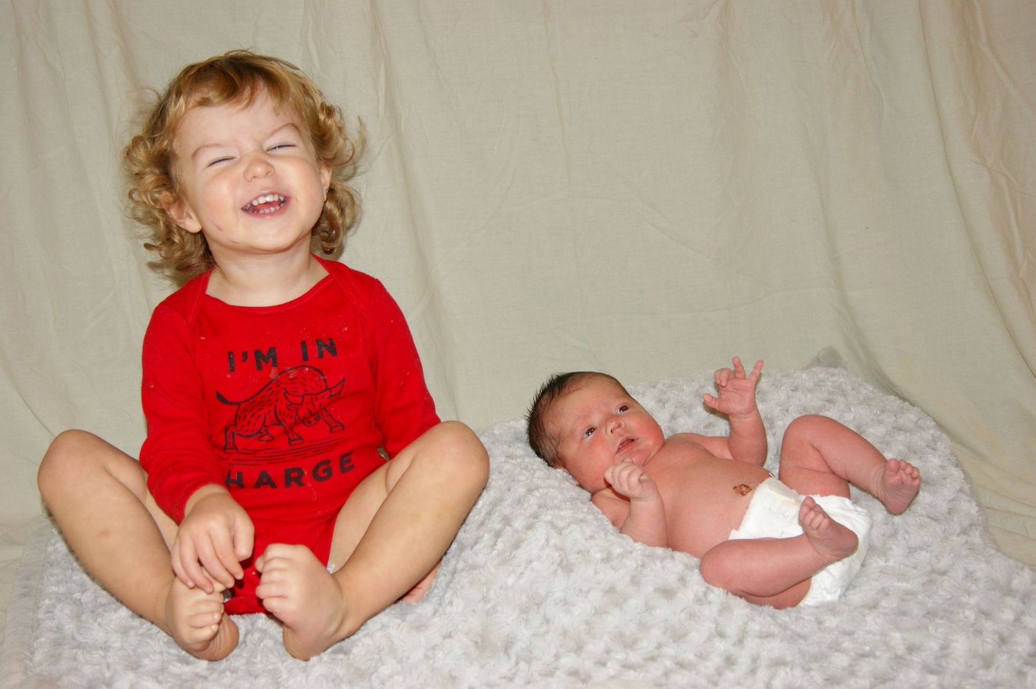 Two siblings sharing a sweet moment.