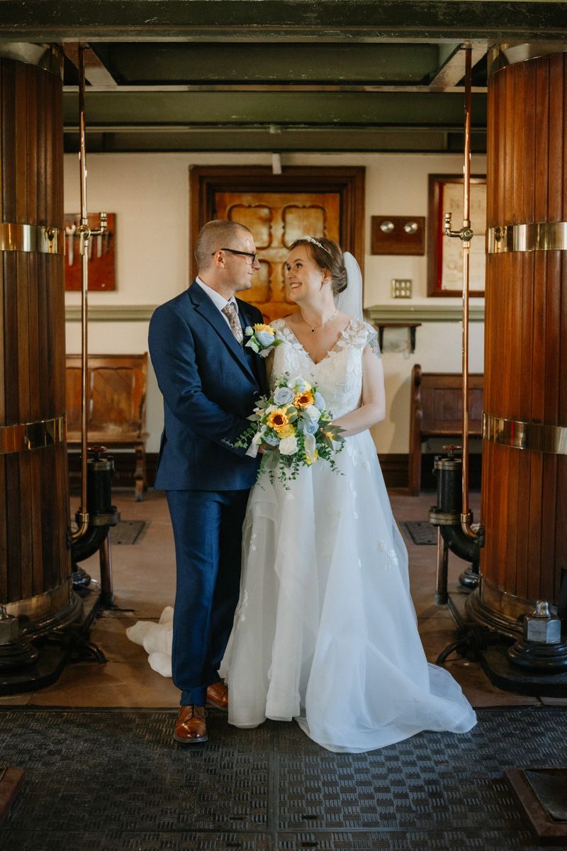Bride and groom share a romantic moment inside Papplewick Pumping Station.